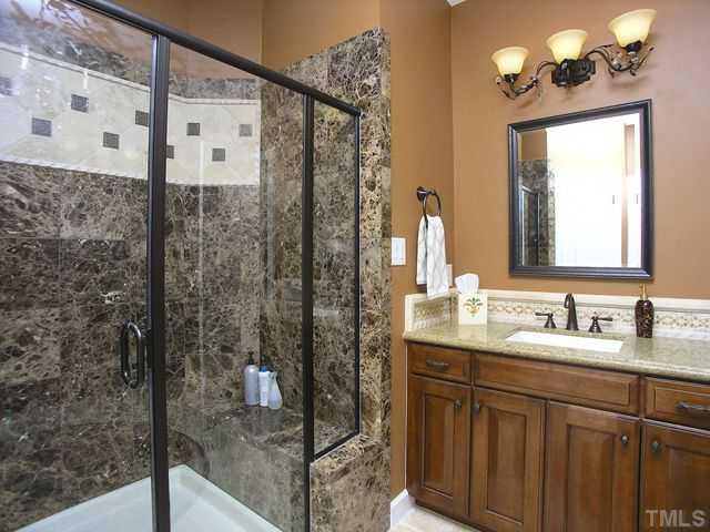 421 Rensford Place Cary, NC 27513 - Photo 13 of 25 a bathroom with a double vanity sink mirror and shower