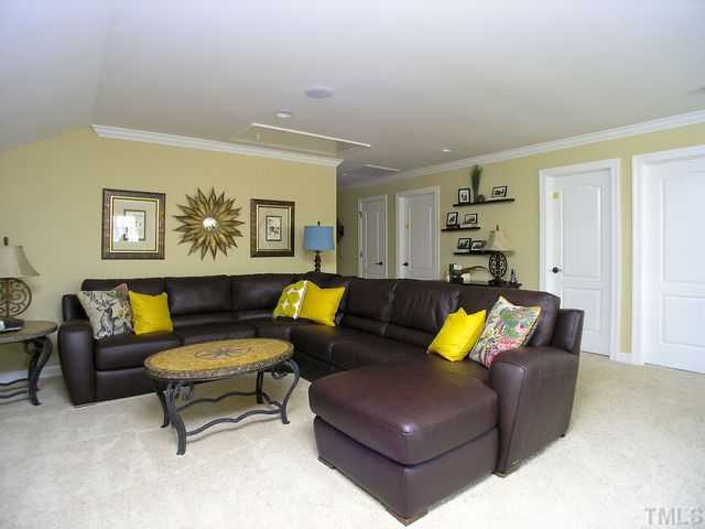 421 Rensford Place Cary, NC 27513 - Photo 18 of 25 a living room with furniture and kitchen view