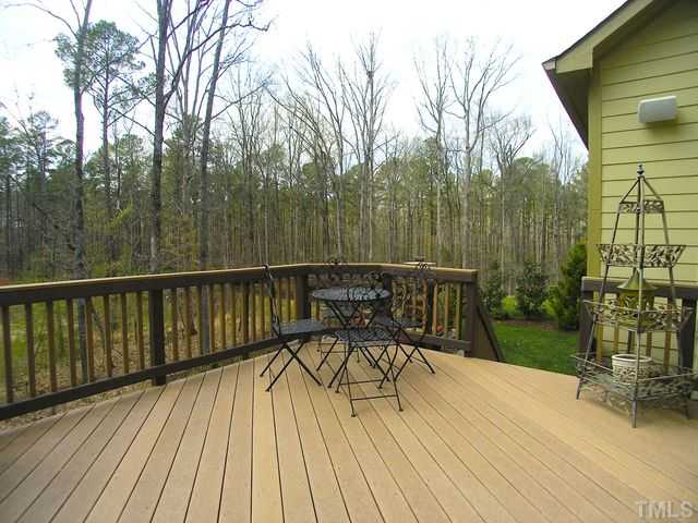 421 Rensford Place Cary, NC 27513 - Photo 19 of 25 a view of a chairs and table on the wooden deck