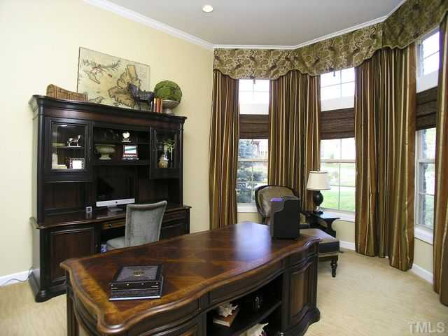 421 Rensford Place Cary, NC 27513 - Photo 3 of 25 a living room with furniture and a window