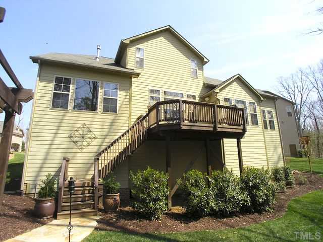 421 Rensford Place Cary, NC 27513 - Photo 25 of 25 a front view of a house with garden