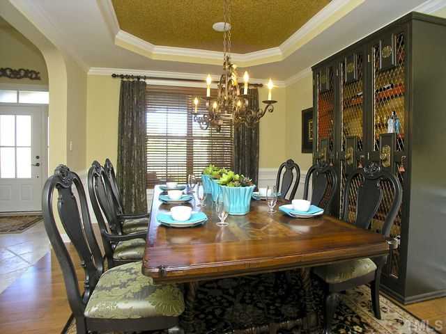 421 Rensford Place Cary, NC 27513 - Photo 4 of 25 a view of a dining room with furniture and window