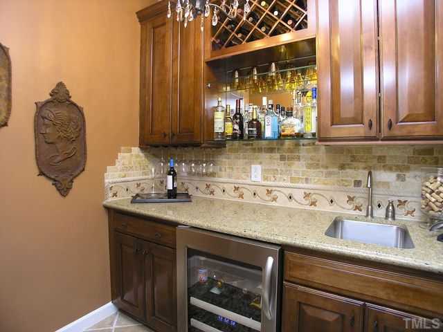 421 Rensford Place Cary, NC 27513 - Photo 10 of 25 a kitchen with a sink and a window