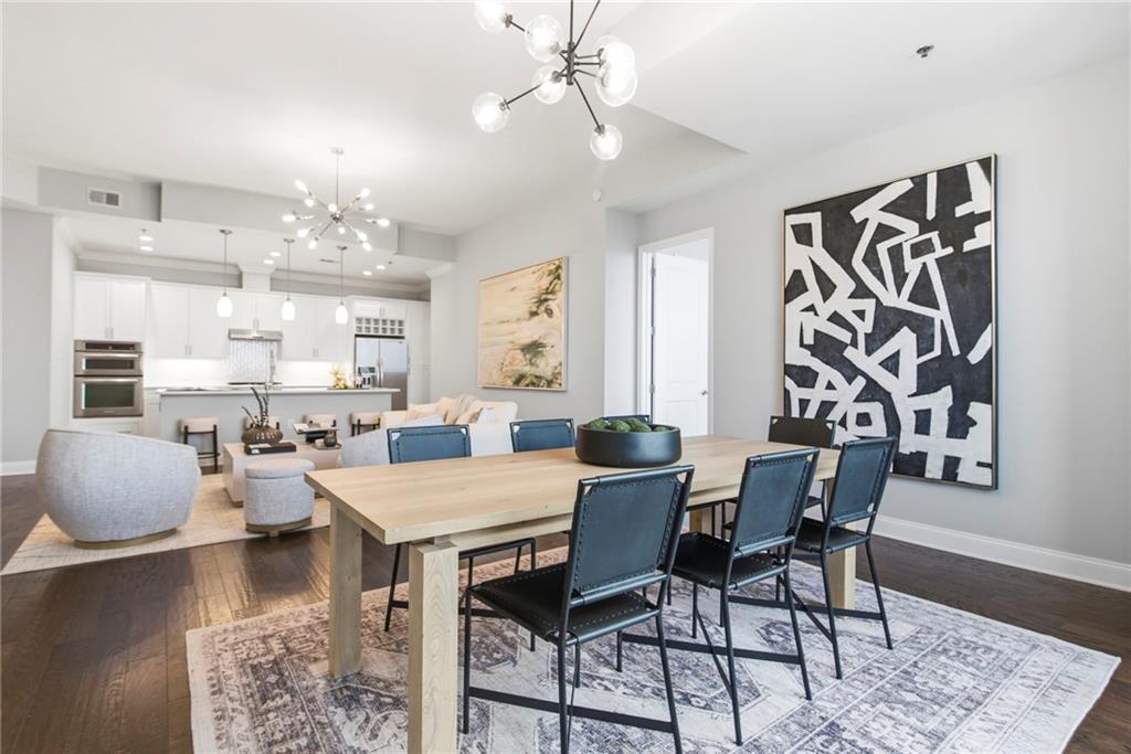 270 17th Street Northwest, Unit 4306 Atlanta, GA 30363 - Photo 15 of 37 a view of a dining room with furniture and wooden floor