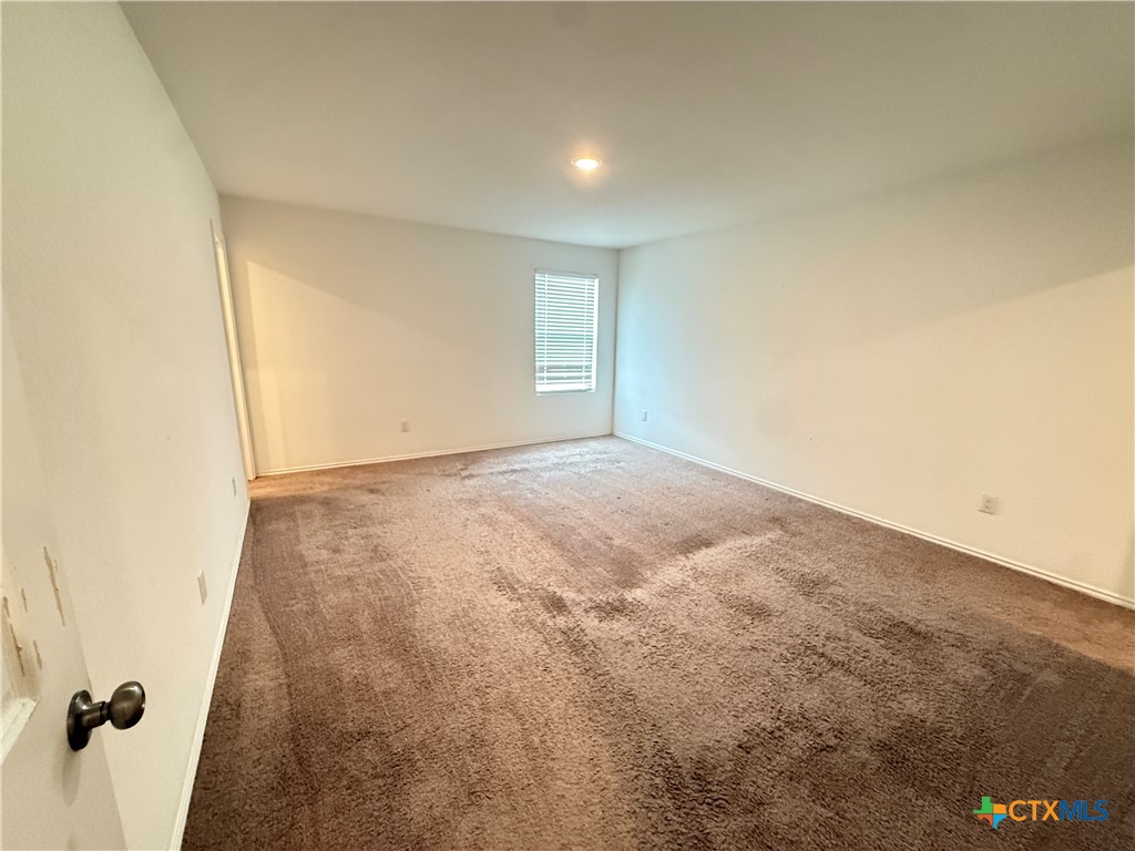 5863 Coahulia Ridge Seguin, TX 78155 - Photo 12 of 15 an empty room with windows
