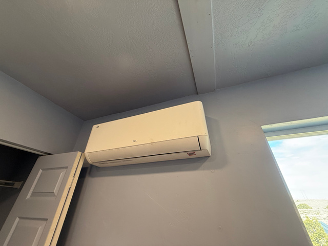 14183 High Mesa Loop Duchesne, UT 84021 - Photo 45 of 56 Detailed view of a wall mounted mini split and a textured ceiling