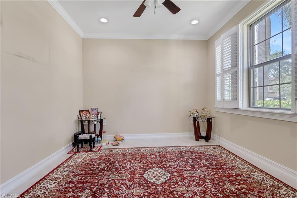 16309 Aberdeen Way Naples, FL 34110 - Photo 5 of 34 wooden floor in a hall with a window