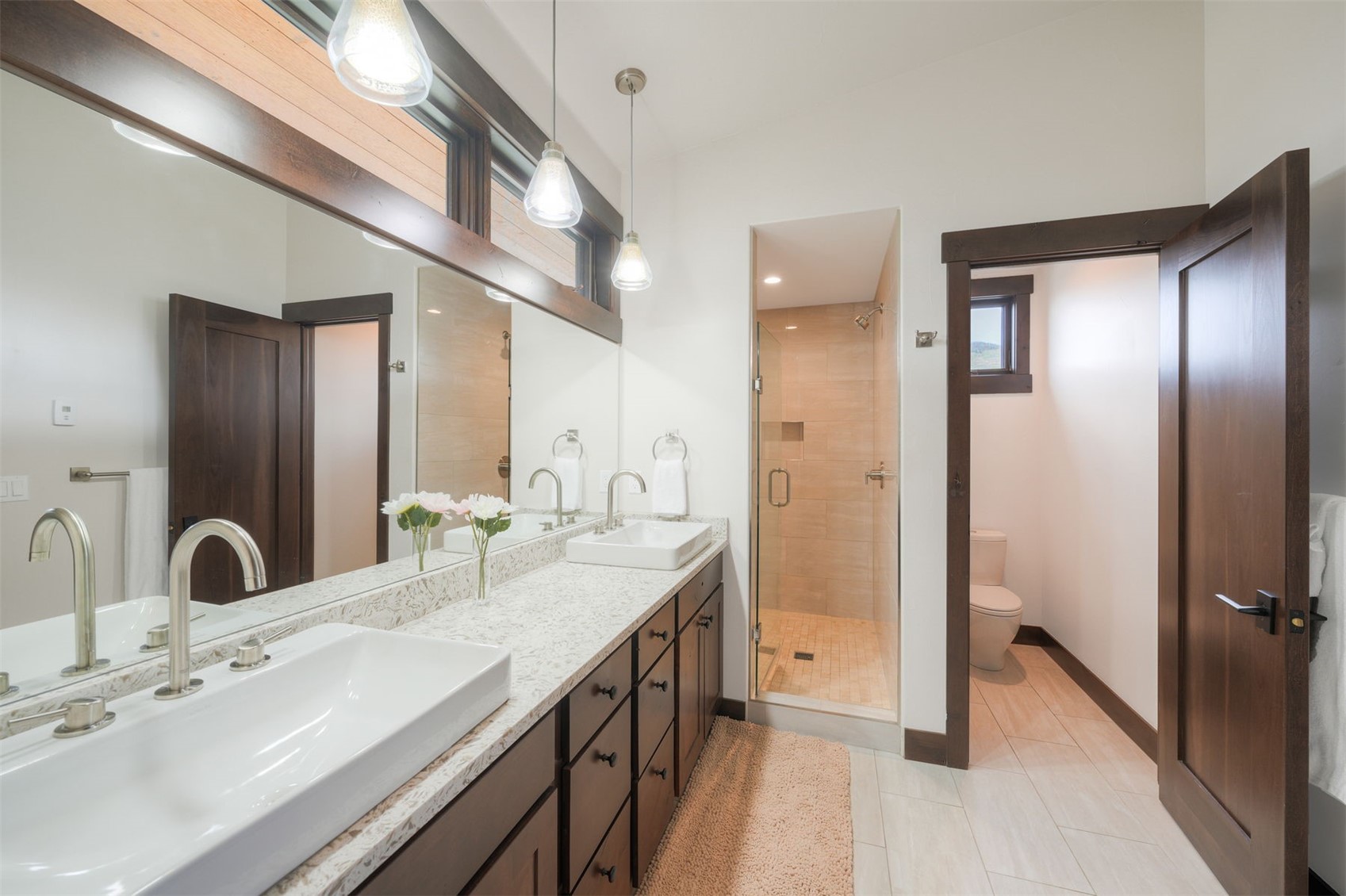 21 Moss Way Silverthorne, CO 80498 - Photo 21 of 50 a spacious bathroom with a double vanity sink mirror and shower