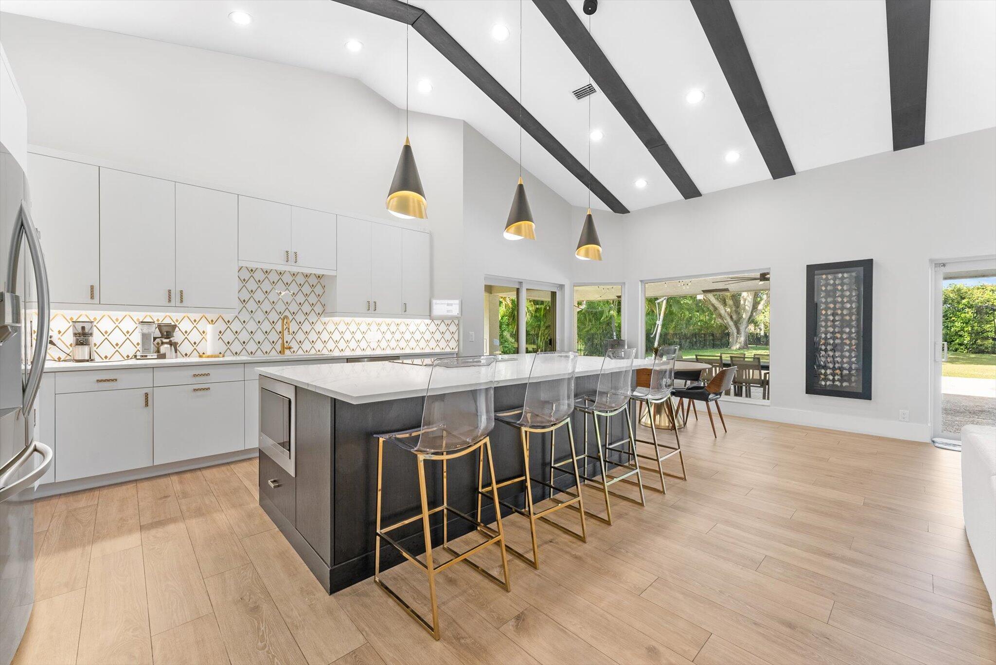 4429 Woodfield Boulevard Boca Raton, FL 33434 - Photo 18 of 61 a kitchen with lots of counter top space