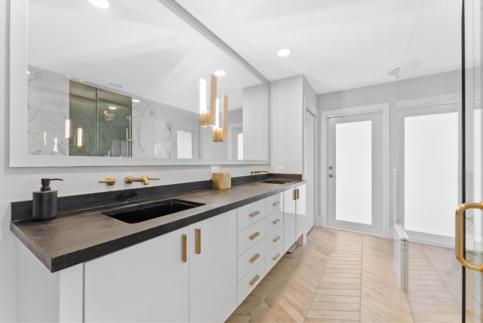 4429 Woodfield Boulevard Boca Raton, FL 33434 - Photo 27 of 61 a kitchen with granite countertop a sink and cabinets