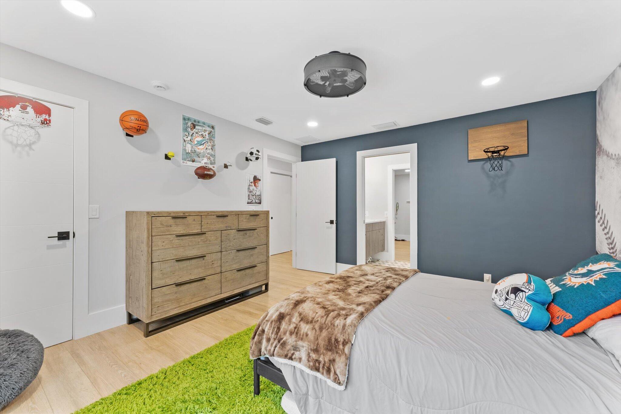 4429 Woodfield Boulevard Boca Raton, FL 33434 - Photo 29 of 61 a bedroom with a bed and a window