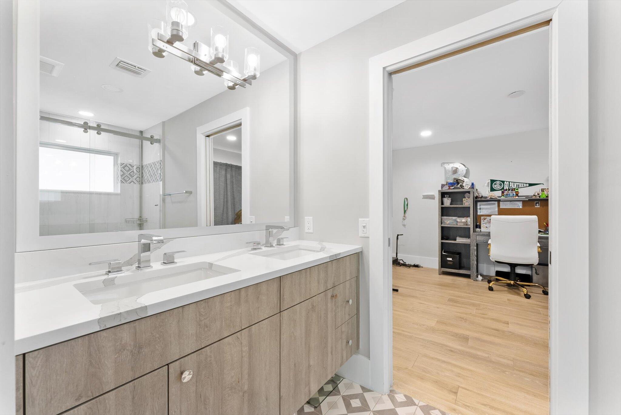 4429 Woodfield Boulevard Boca Raton, FL 33434 - Photo 31 of 61 a en suite bathroom with a double vanity sink mirror and