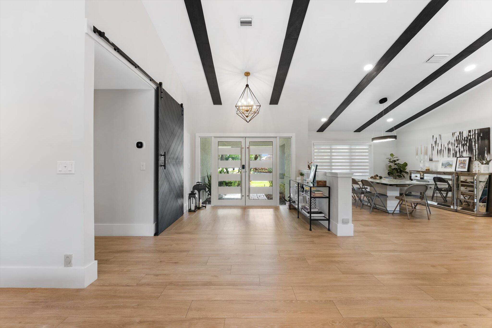 4429 Woodfield Boulevard Boca Raton, FL 33434 - Photo 6 of 61 a view of a livingroom with furniture and a ceiling fan