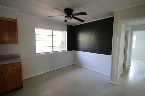 118 Peach Tree Street Paxton, FL 32567 - Photo 12 of 34 a view of an empty room with a window