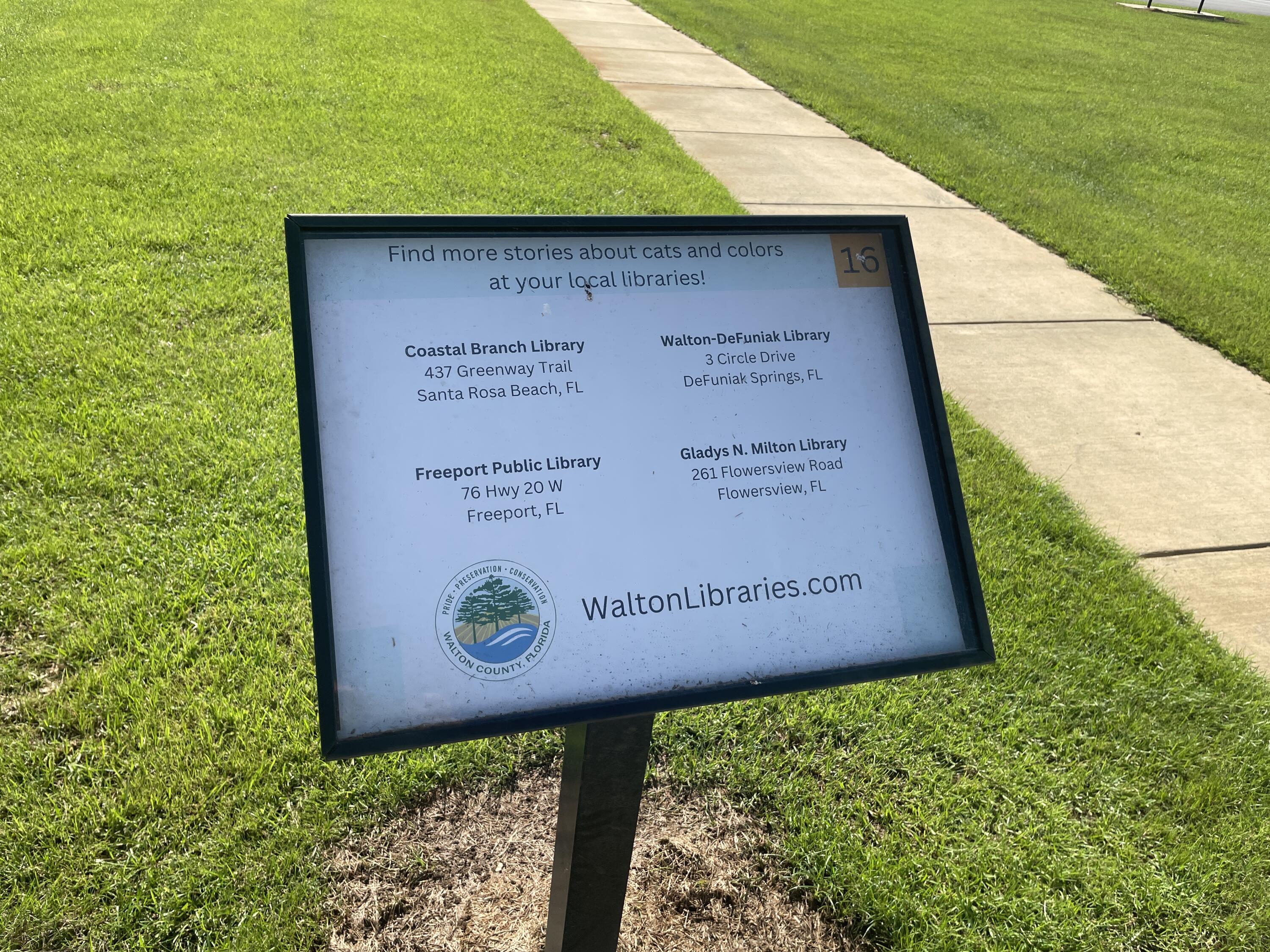 118 Peach Tree Street Paxton, FL 32567 - Photo 27 of 33 a view of a sign in front of a building