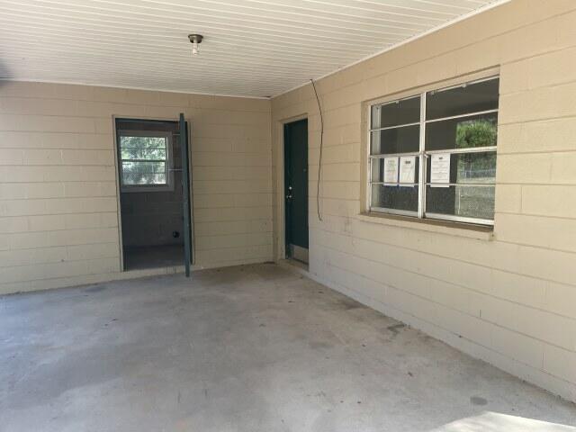 118 Peach Tree Street Paxton, FL 32567 - Photo 7 of 34 an empty room with windows