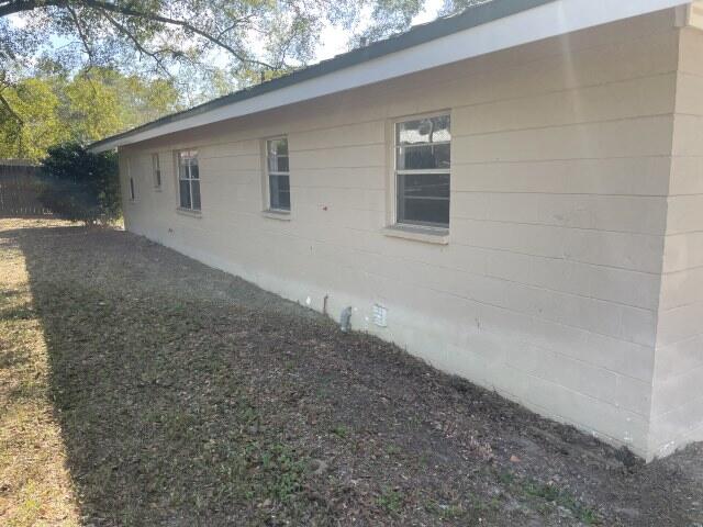 118 Peach Tree Street Paxton, FL 32567 - Photo 8 of 34 a backyard of a house with lots of green space