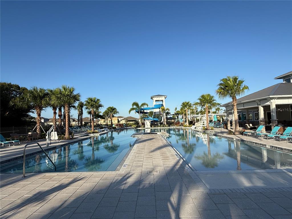 12434 Radiant Crystal Rose Place Parrish, FL 34219 - Photo 35 of 39 a view of a swimming pool with outdoor seating