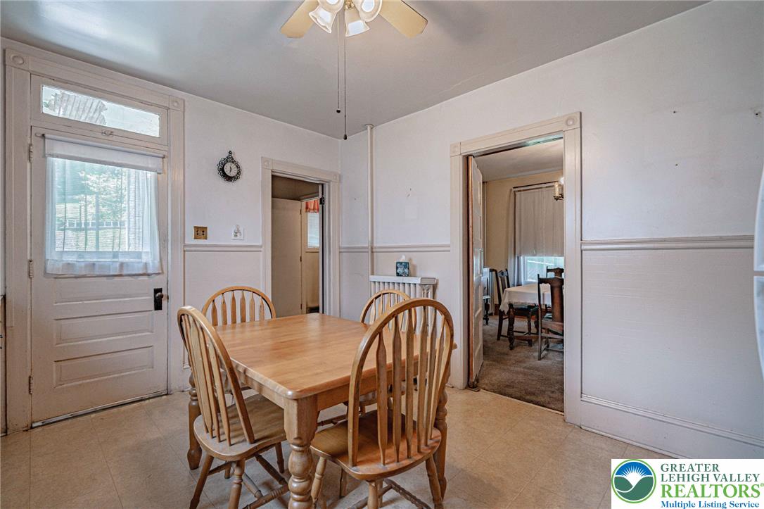 159 West Ridge Street Nesquehoning, PA 18240 - Photo 16 of 55 A light-filled eat-in kitchen with classic wainscoting offers comfortable dining.
