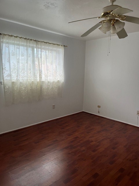 10923 Concho Street Houston, TX 77072 - Photo 2 of 6 a view of a room with wooden floor fan and windows