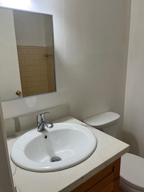 10923 Concho Street Houston, TX 77072 - Photo 5 of 6 a bathroom with a sink and a mirror