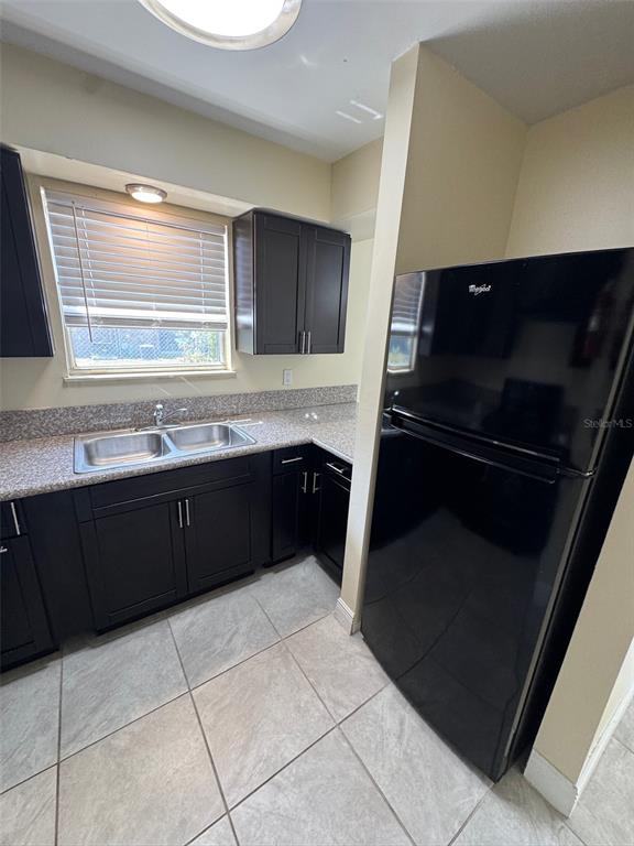 1179 Bentley Road, Unit 4 Leesburg, FL 34748 - Photo 6 of 10 a kitchen with a sink and a stove top oven
