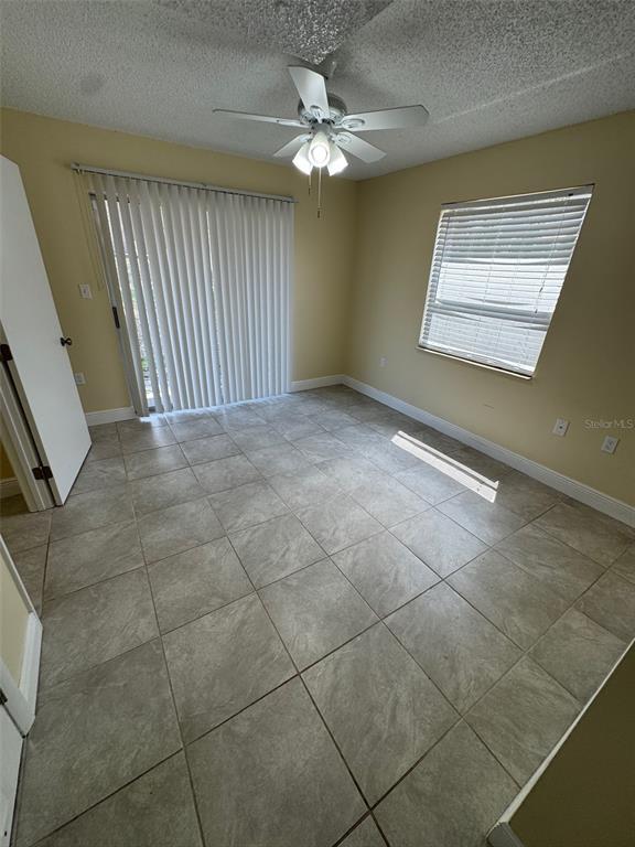 1179 Bentley Road, Unit 4 Leesburg, FL 34748 - Photo 7 of 10 a view of an empty room with a window