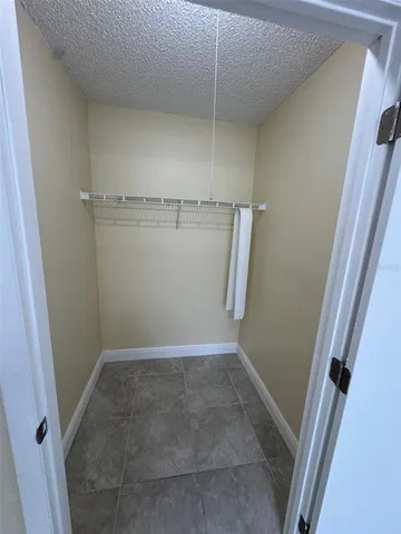 a spacious bathroom with a granite countertop sink toilet and shower