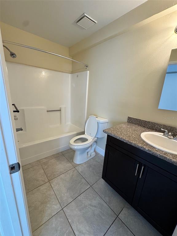 1179 Bentley Road, Unit 4 Leesburg, FL 34748 - Photo 10 of 10 a spacious bathroom with a granite countertop sink toilet and shower
