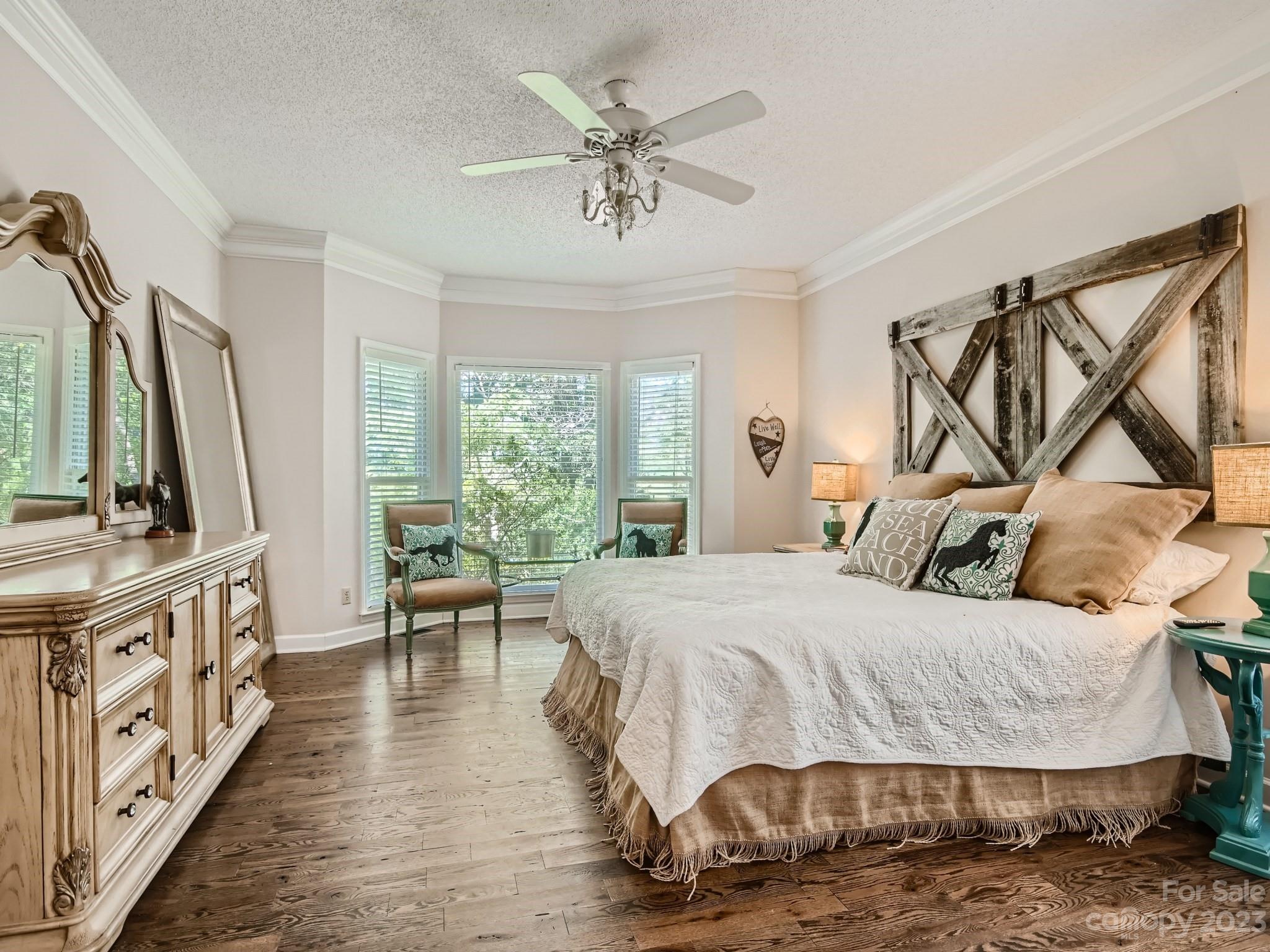 1815 Rock Rest Road Wingate, NC 28174 - Photo 13 of 27 a bedroom with a bed a couch and dresser