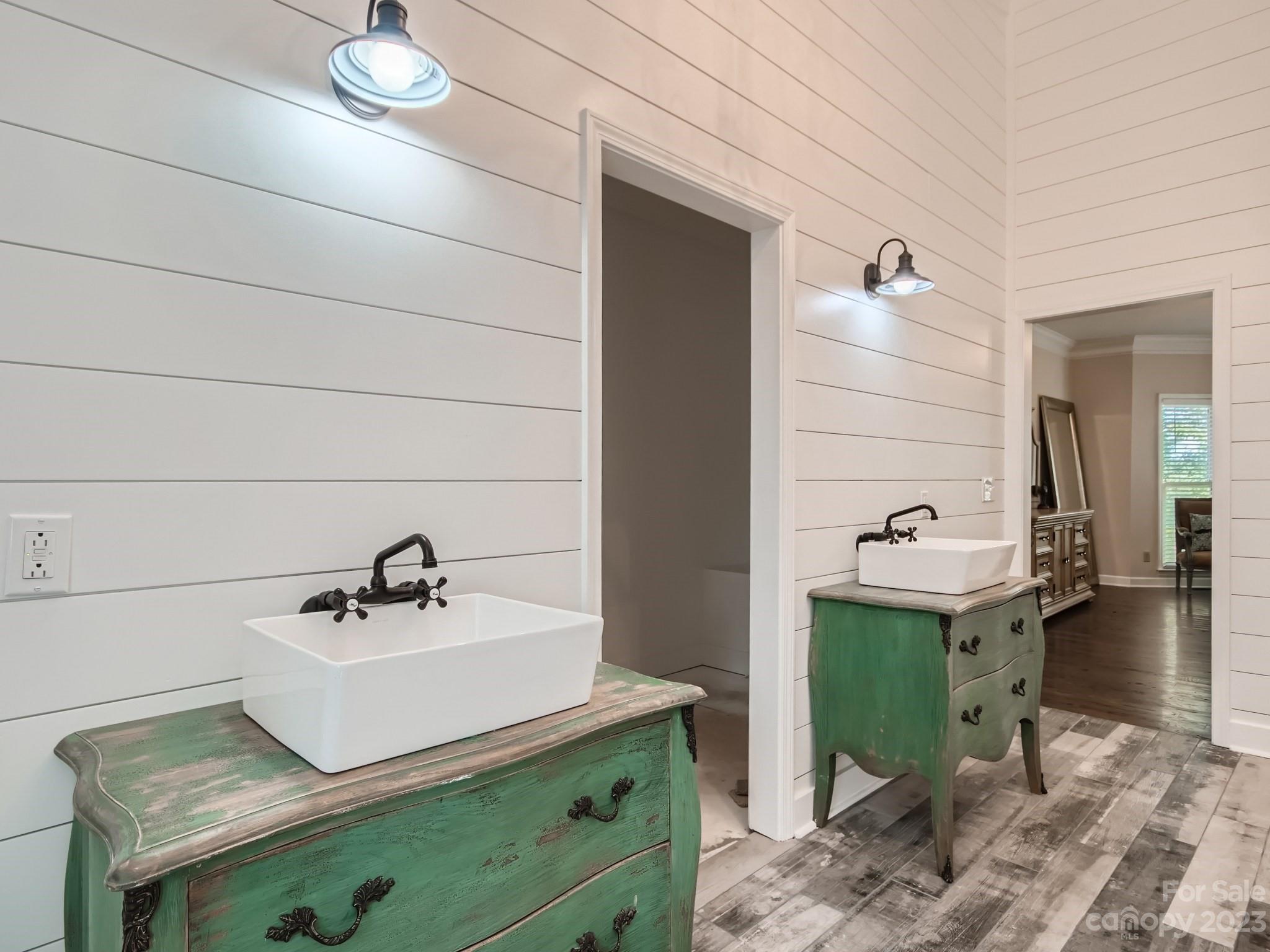 1815 Rock Rest Road Wingate, NC 28174 - Photo 17 of 27 a bathroom with a sink and a mirror