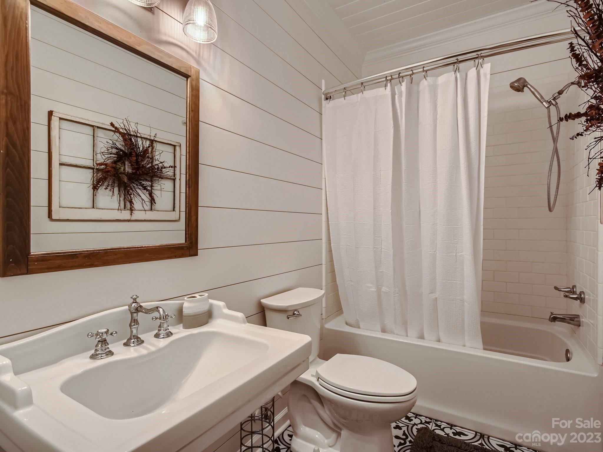 1815 Rock Rest Road Wingate, NC 28174 - Photo 20 of 27 a bathroom with a sink a toilet and a bathtub