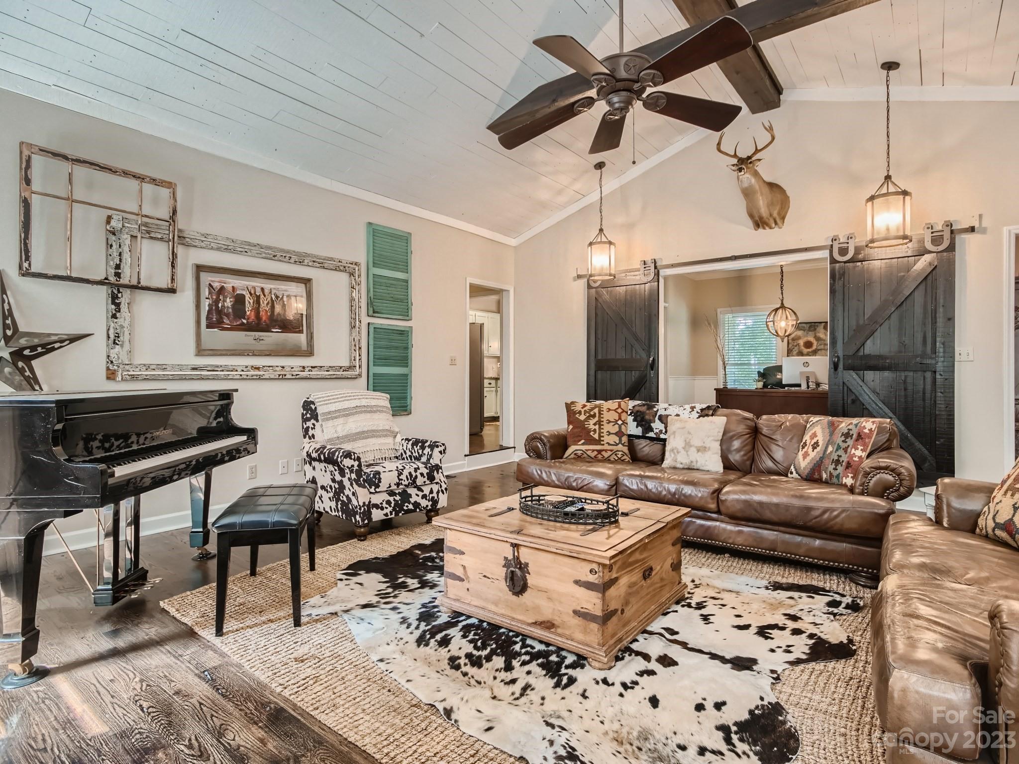 1815 Rock Rest Road Wingate, NC 28174 - Photo 5 of 27 a living room with furniture and a chandelier