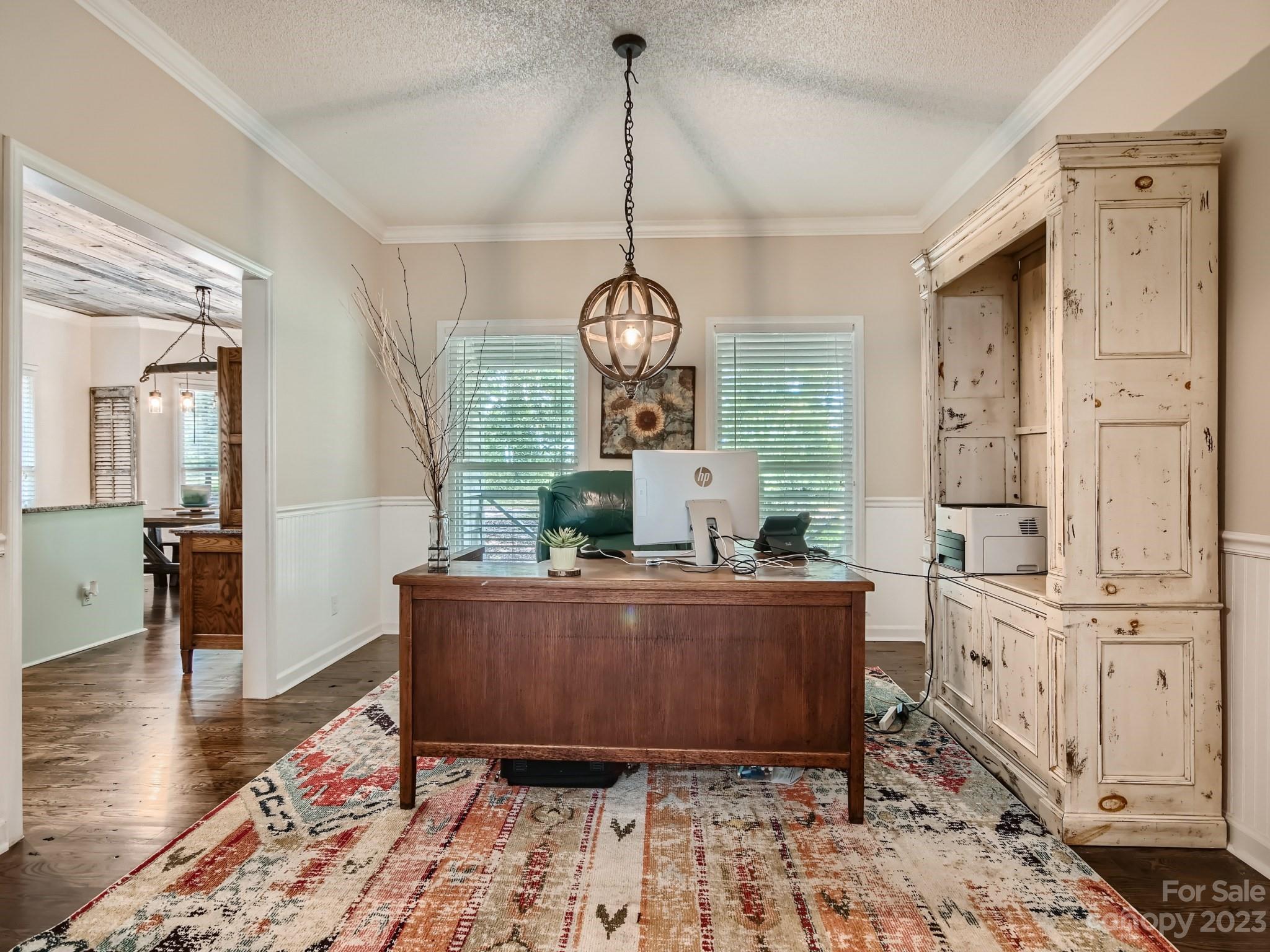 1815 Rock Rest Road Wingate, NC 28174 - Photo 8 of 27 a living room with furniture and a chandelier