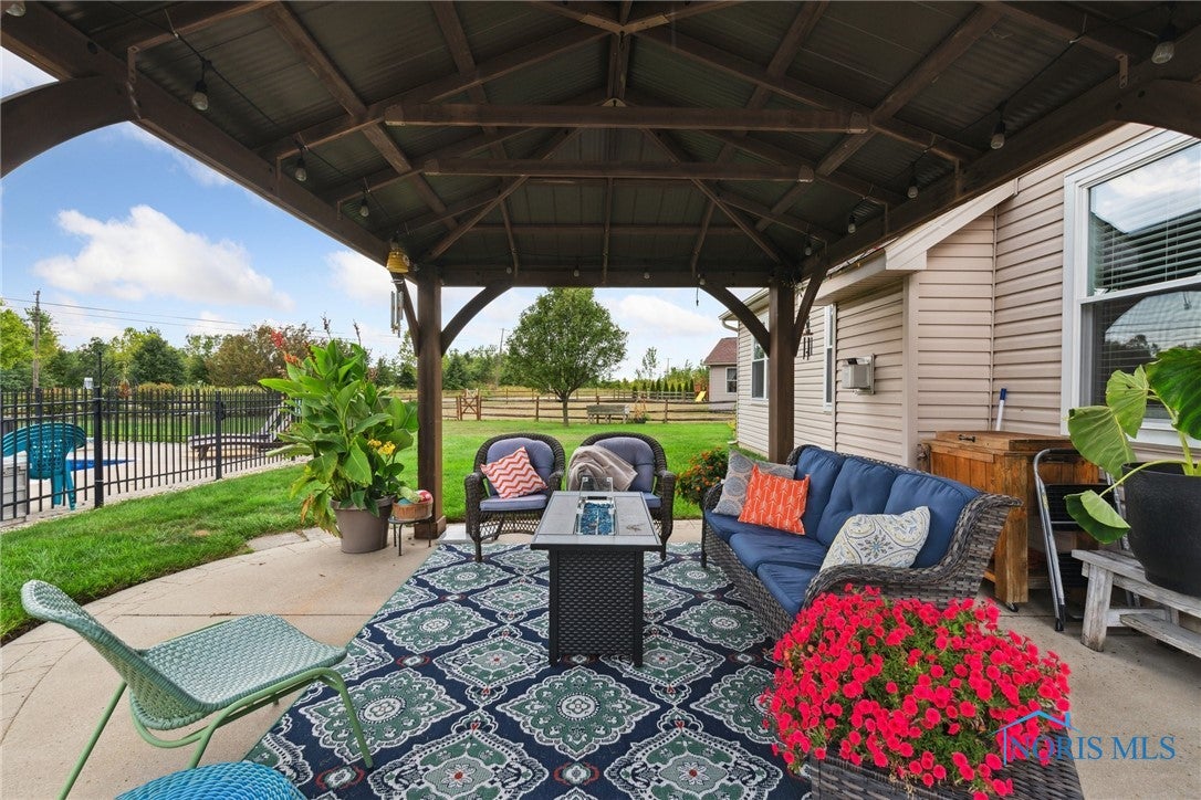166 Lawai Road Oregon, OH 43616 - Photo 37 of 48 Costco gazebo is bolted down and secure. Perfect for morning coffee or sunsets.