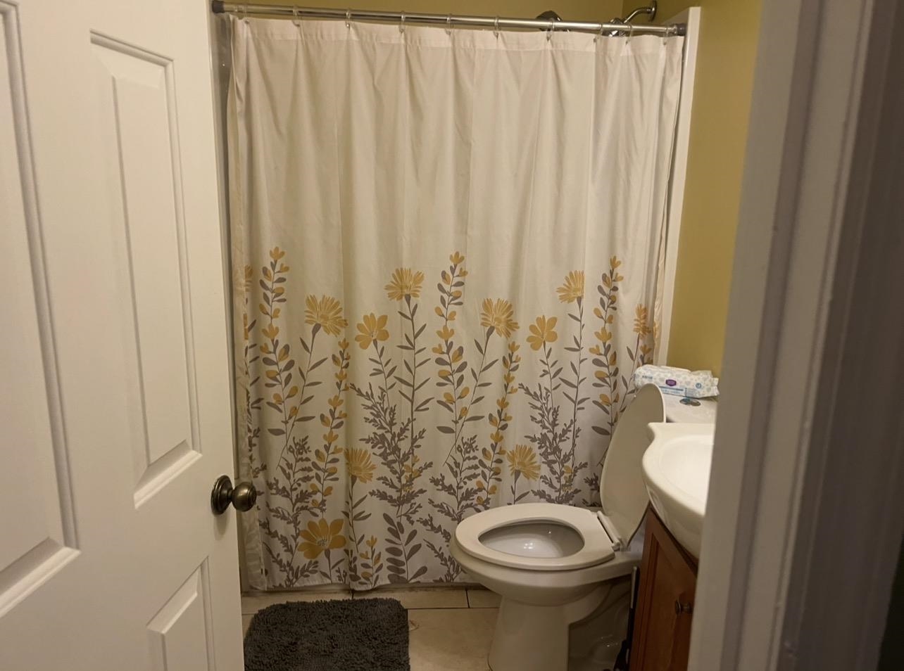 1025 Carolina Road, Unit O1 Conway, SC 29526 - Photo 11 of 18 Full bathroom featuring light tile patterned flooring, vanity, and curtained shower