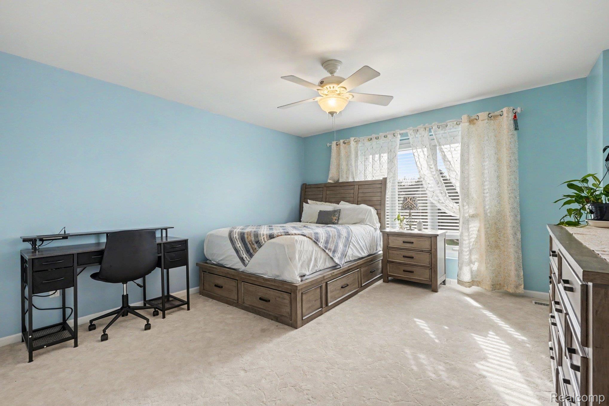 1941 Mapleridge Road Rochester, MI 48309 - Photo 27 of 55 Bedroom with light colored carpet, ceiling fan, and an office area