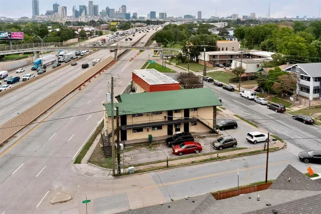 a view of a patio with table and chairs