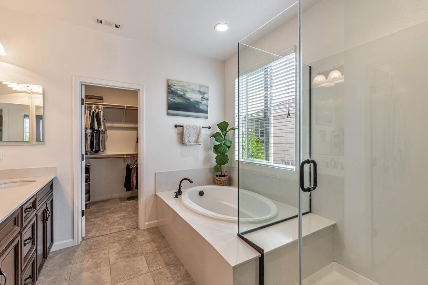 51 Koror Lane Gilroy, CA 95020 - Photo 29 of 50 a bathroom with a tub sink and mirror