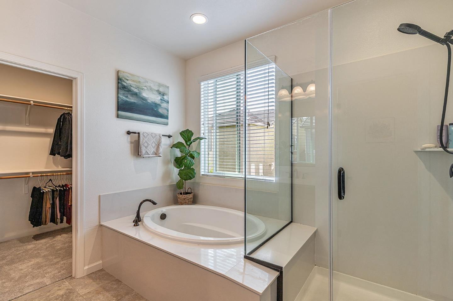 51 Koror Lane Gilroy, CA 95020 - Photo 31 of 50 a bathroom with a tub sink and a mirror