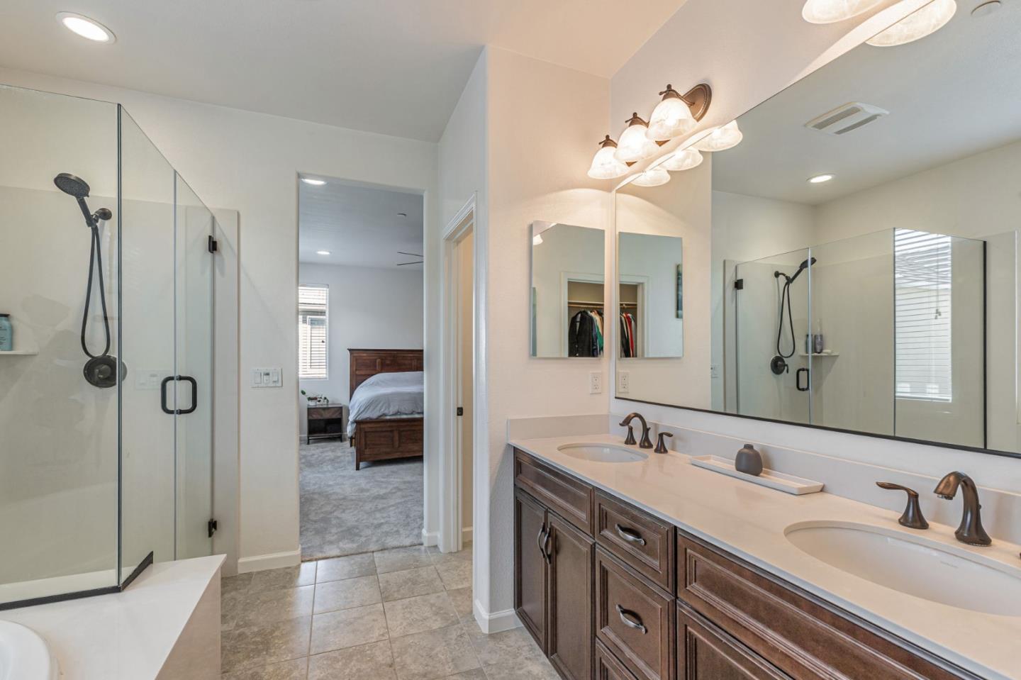 51 Koror Lane Gilroy, CA 95020 - Photo 33 of 50 a en suite bathroom with a double vanity sink mirror and shower