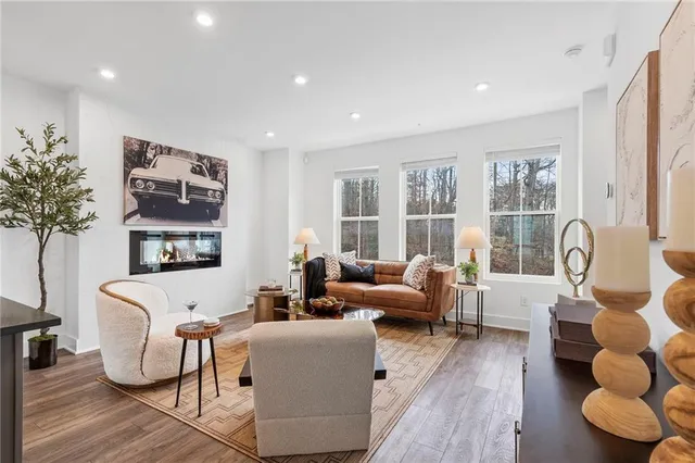 a living room with furniture and a large window