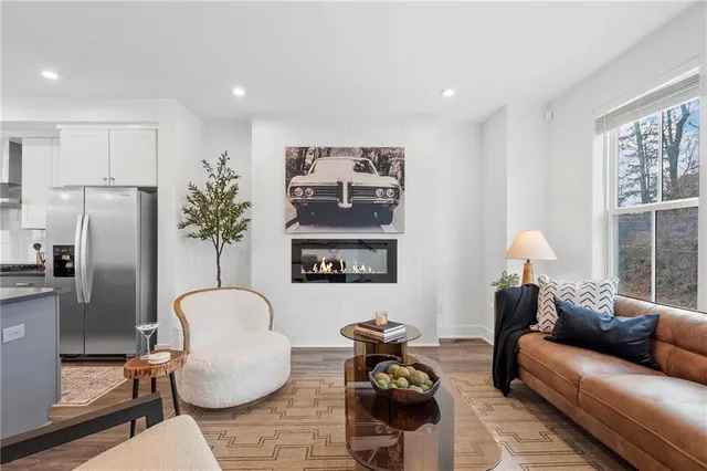 a living room with furniture and a window