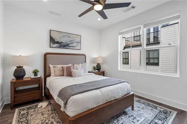 a bedroom with a large bed and a window