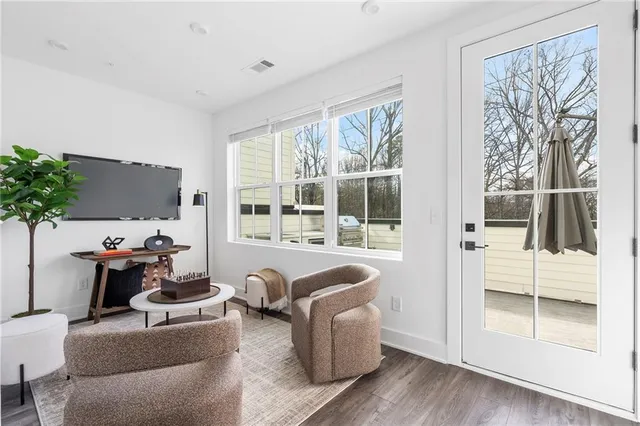a living room with furniture a patio and a window