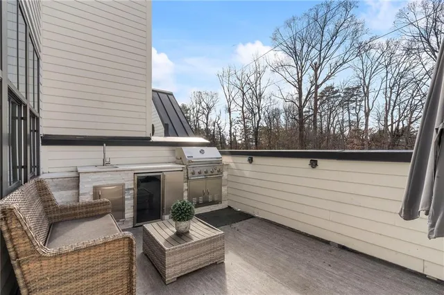 a view of backyard with seating area and oven