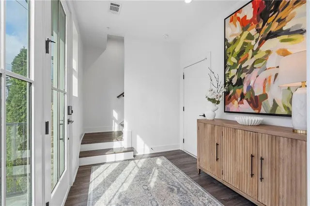 a view of front door with wooden floor