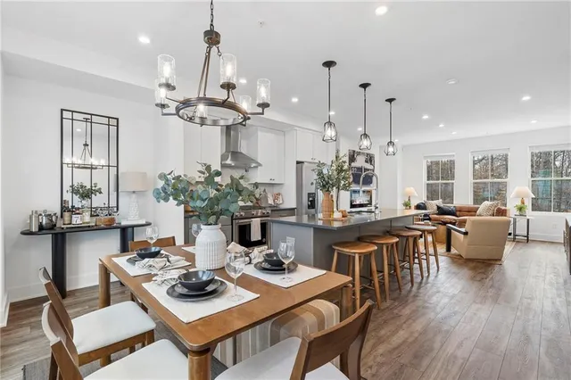 a view of a dining room with furniture window and wooden floor