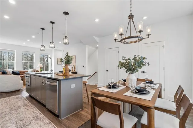 a kitchen with a table and chairs in it
