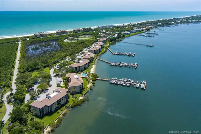 an aerial view of a city with ocean view